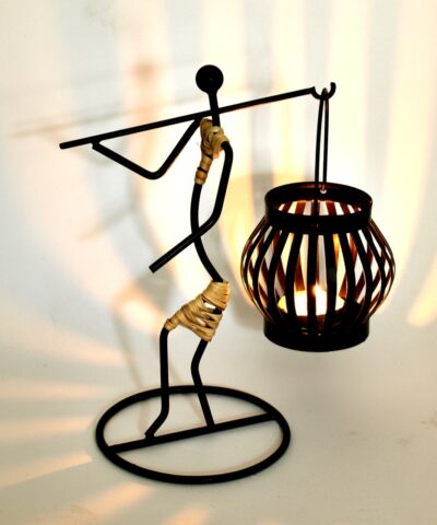 Lantern Lady Set Candle Holder is inspired from traditional Bastar Arts & Crafts and its been blended in to closest imitation. The construction of the Candle Holder gives a dramatic look of shadow and light and feel in its appearance. The Candle holders can be used with LED Candles, Wax Candles, as well as decorative. The product is hand crafted & assembled in multiple layers of refined processes, by skilled artisans. Each Lantern is finished with multiple layers of coating, which makes it resistant, and gives it a longer shelf life. Each product is Quality checked at multiple layers and processes. Creatively this product can be used for various purpose and occasions, Can be used for Wedding Gift, Party Decoration, indoor and outdoor for lawns gardens etc. It is an ideal gift for a housewarming, an ideal gift for a colleague or friend. Light and Shadow effect gives it a perfect mood for decoration at various occasions. Candle Holder can be on the table for indoor and outdoor. Each set of 3 pcs packed in a brown corrugated box. Size 5 inches Available Colors - Matte Gold & Natural Cane Disclaimer - All products are handmade and are subject to variation. Not 2 products will be 100% same. All our products are handcrafted by skilled Artisans, Made in India.