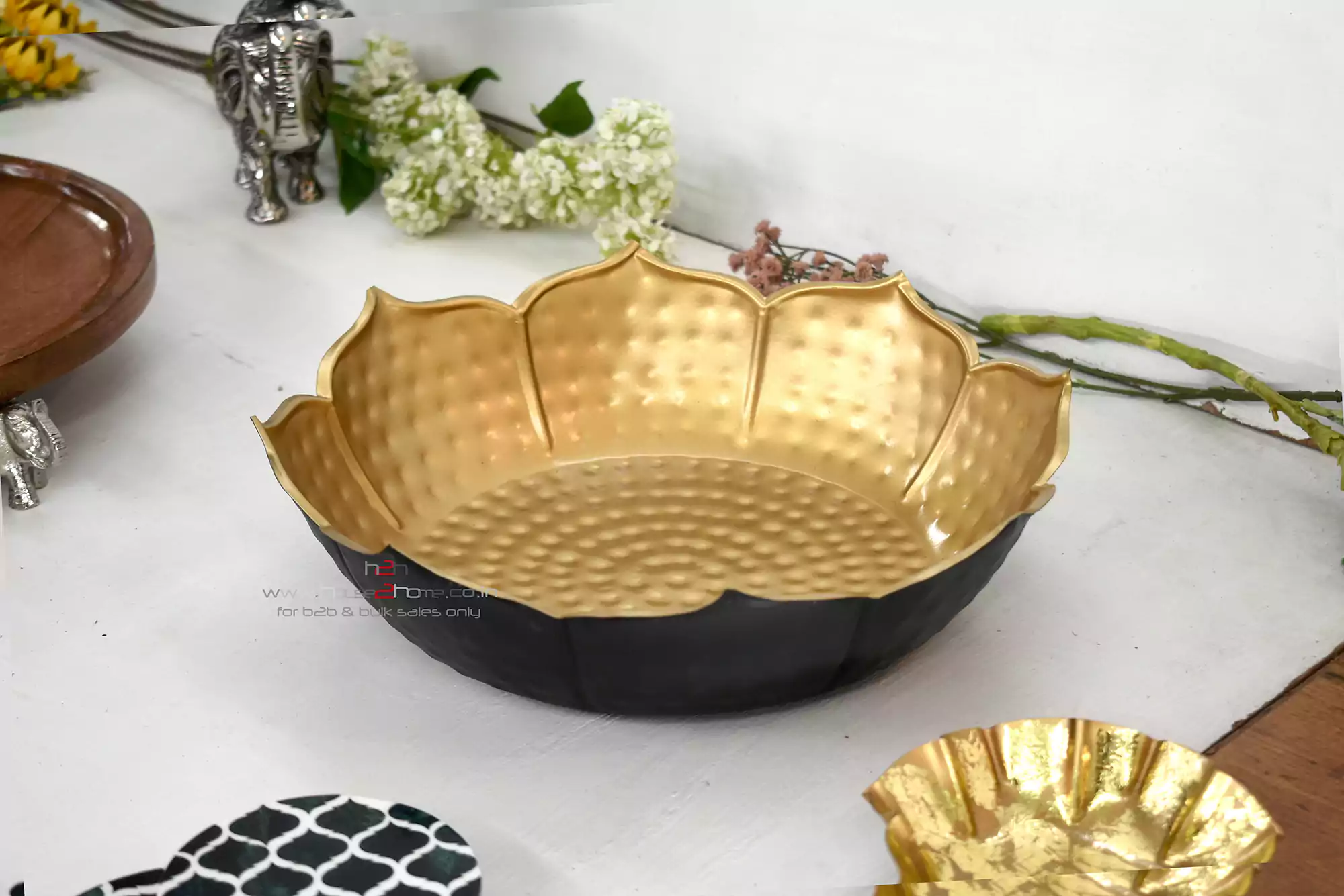 Urli, Lotus Urli, Petal Shaped Urli, Metal Urli, Hamper Basket, Gift Pack, Home Decor, Decorative, Party Decoration, Table Decor, house warming, house2home, h2h, flower decoration, lotus Urli, Hamper Pack, Gift Basket, Holiday Basket, parat, decor, decorative, flower decoration, home decor, diwali Decor, Return Gift, Diwali Gift, Here are keywords for a metal urli carved in two-tone black and gold, for decoration, gifting, and hamper purposes: Metal urli, Carved metal urli, Two-tone urli, Black and gold urli, Decorative metal urli, Gifting urli, Urli for decoration, Metal urli for hampers, Black gold carved urli, Elegant metal urli, Urli for home decor, Luxury metal urli, Dual-tone metal urli, Black and gold decorative urli, Urli for gifting, Carved urli for hampers, Urli centerpiece, Urli for festive decor, Metal decor urli, Black gold urli for gifts, Handcrafted metal urli, Stylish urli, Artistic metal urli, Premium metal urli, Modern metal urli, Decorative centerpiece urli, Urli for special occasions, Metal urli decor, Traditional metal urli, Urli for celebrations, Urli for wedding decor, Urli for events, Unique metal urli, Ornate metal urli, Black and gold centerpiece, Festive urli, Vintage style metal urli, Classic metal urli, Carved urli for decoration, Metal urli gift item, Elegant urli decor, Decorative gift urli, Dual-color metal urli, Black and gold ornament, Urli for luxury gifting, Decorative carved urli, Urli for home accents, Artistic carved urli, Modern decor urli, Premium urli for gifting, Two-tone carved urli, Metal Urli, Gold Urli, GOlden Bowl, Hammered Bowl, Decorative Urli, Home Decor, Diwali Decor, Decoration, house2home, h2h, Table Top, Lotus Metal