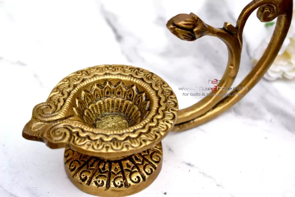Brass lotus diya, Sanskriti lotus diya, antique brass diya, pooja diya, traditional brass lamp, Indian festival diya, wedding gift diya, diya for home temple, Diwali brass diya, housewarming return gift, Lakshmi pooja diya, handmade diya, lotus shaped diya, decorative brass lamp, diya for mandir, vastu diya, Navratri diya, brass oil lamp, diya for gifting, artisanal diya, Indian decor diya, South Indian brass diya, pure brass diya, pooja essentials, puja diya, brass deepam, spiritual home decor, diya for rituals, handcrafted diya, divine brass diya, temple diya, brass decor piece, diya for aarti, diya with stand, lotus flower diya, vintage diya design, diya set for pooja, Indian brass handicraft, gifting diya, traditional deepak, religious diya, brass deepak, brass diya for Diwali, brass diya India, diya for puja room, diya for Lakshmi pooja, lotus deepak, diya for festive use, diya decoration, diya for temple decor, diya for return gift, diya for pooja room, Indian diya, artisan diya India, diya for Deepavali, kannada deepa, deepam telugu, kannada brass deepa, telugu pooja deepam, diya gift set, diya wedding return gift, diya for Navratri return gift, diya combo set, brass diya bulk order, diya wholesale, decorative diya online, diya pooja item, diya for Indian festivals, diya Diwali decoration, Diwali diya gift, pooja lamp brass, Lakshmi deepam, Krishna pooja diya, diya for prayers, diya Indian traditions, South Indian diya lamp, diya for spiritual use, diya for daily pooja, diya small brass, diya lotus shape, diya for gifting occasions, diya mandir item, Diwali pooja diya, diya for good luck, diya symbol of light, diya positive energy, diya for rituals India, diya handmade India, brass diya 5 inch, brass diya heavy, diya thick base, diya for worship, diya heritage look, diya traditional Indian, Indian spiritual diya, diya in bulk, diya wholesale brass, diya combo gifting, diya handmade India, diya design unique, diya Indian craftsmanship, diya from India, diya from Karnataka, diya from Andhra, diya from Telangana, diya pooja purpose, diya with antique finish, diya glossy look, diya heritage piece, diya pooja collection, diya spiritual feel, diya unique brass, diya lotus motif, diya lotus pattern, diya Indian gift, diya pooja diya, diya South decor, diya wedding pack, diya temple accessory, diya traditional diya, diya Indian theme, diya Indian return gift, diya pure brass finish, diya solid metal, diya auspicious gifting, diya decorative collectible