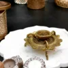 Brass lotus diya, Sanskriti lotus diya, antique brass diya, pooja diya, traditional brass lamp, Indian festival diya, wedding gift diya, diya for home temple, Diwali brass diya, housewarming return gift, Lakshmi pooja diya, handmade diya, lotus shaped diya, decorative brass lamp, diya for mandir, vastu diya, Navratri diya, brass oil lamp, diya for gifting, artisanal diya, Indian decor diya, South Indian brass diya, pure brass diya, pooja essentials, puja diya, brass deepam, spiritual home decor, diya for rituals, handcrafted diya, divine brass diya, temple diya, brass decor piece, diya for aarti, diya with stand, lotus flower diya, vintage diya design, diya set for pooja, Indian brass handicraft, gifting diya, traditional deepak, religious diya, brass deepak, brass diya for Diwali, brass diya India, diya for puja room, diya for Lakshmi pooja, lotus deepak, diya for festive use, diya decoration, diya for temple decor, diya for return gift, diya for pooja room, Indian diya, artisan diya India, diya for Deepavali, kannada deepa, deepam telugu, kannada brass deepa, telugu pooja deepam, diya gift set, diya wedding return gift, diya for Navratri return gift, diya combo set, brass diya bulk order, diya wholesale, decorative diya online, diya pooja item, diya for Indian festivals, diya Diwali decoration, Diwali diya gift, pooja lamp brass, Lakshmi deepam, Krishna pooja diya, diya for prayers, diya Indian traditions, South Indian diya lamp, diya for spiritual use, diya for daily pooja, diya small brass, diya lotus shape, diya for gifting occasions, diya mandir item, Diwali pooja diya, diya for good luck, diya symbol of light, diya positive energy, diya for rituals India, diya handmade India, brass diya 5 inch, brass diya heavy, diya thick base, diya for worship, diya heritage look, diya traditional Indian, Indian spiritual diya, diya in bulk, diya wholesale brass, diya combo gifting, diya handmade India, diya design unique, diya Indian craftsmanship, diya from India, diya from Karnataka, diya from Andhra, diya from Telangana, diya pooja purpose, diya with antique finish, diya glossy look, diya heritage piece, diya pooja collection, diya spiritual feel, diya unique brass, diya lotus motif, diya lotus pattern, diya Indian gift, diya pooja diya, diya South decor, diya wedding pack, diya temple accessory, diya traditional diya, diya Indian theme, diya Indian return gift, diya pure brass finish, diya solid metal, diya auspicious gifting, diya decorative collectible