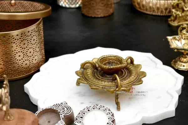 Brass lotus diya, Sanskriti lotus diya, antique brass diya, pooja diya, traditional brass lamp, Indian festival diya, wedding gift diya, diya for home temple, Diwali brass diya, housewarming return gift, Lakshmi pooja diya, handmade diya, lotus shaped diya, decorative brass lamp, diya for mandir, vastu diya, Navratri diya, brass oil lamp, diya for gifting, artisanal diya, Indian decor diya, South Indian brass diya, pure brass diya, pooja essentials, puja diya, brass deepam, spiritual home decor, diya for rituals, handcrafted diya, divine brass diya, temple diya, brass decor piece, diya for aarti, diya with stand, lotus flower diya, vintage diya design, diya set for pooja, Indian brass handicraft, gifting diya, traditional deepak, religious diya, brass deepak, brass diya for Diwali, brass diya India, diya for puja room, diya for Lakshmi pooja, lotus deepak, diya for festive use, diya decoration, diya for temple decor, diya for return gift, diya for pooja room, Indian diya, artisan diya India, diya for Deepavali, kannada deepa, deepam telugu, kannada brass deepa, telugu pooja deepam, diya gift set, diya wedding return gift, diya for Navratri return gift, diya combo set, brass diya bulk order, diya wholesale, decorative diya online, diya pooja item, diya for Indian festivals, diya Diwali decoration, Diwali diya gift, pooja lamp brass, Lakshmi deepam, Krishna pooja diya, diya for prayers, diya Indian traditions, South Indian diya lamp, diya for spiritual use, diya for daily pooja, diya small brass, diya lotus shape, diya for gifting occasions, diya mandir item, Diwali pooja diya, diya for good luck, diya symbol of light, diya positive energy, diya for rituals India, diya handmade India, brass diya 5 inch, brass diya heavy, diya thick base, diya for worship, diya heritage look, diya traditional Indian, Indian spiritual diya, diya in bulk, diya wholesale brass, diya combo gifting, diya handmade India, diya design unique, diya Indian craftsmanship, diya from India, diya from Karnataka, diya from Andhra, diya from Telangana, diya pooja purpose, diya with antique finish, diya glossy look, diya heritage piece, diya pooja collection, diya spiritual feel, diya unique brass, diya lotus motif, diya lotus pattern, diya Indian gift, diya pooja diya, diya South decor, diya wedding pack, diya temple accessory, diya traditional diya, diya Indian theme, diya Indian return gift, diya pure brass finish, diya solid metal, diya auspicious gifting, diya decorative collectible